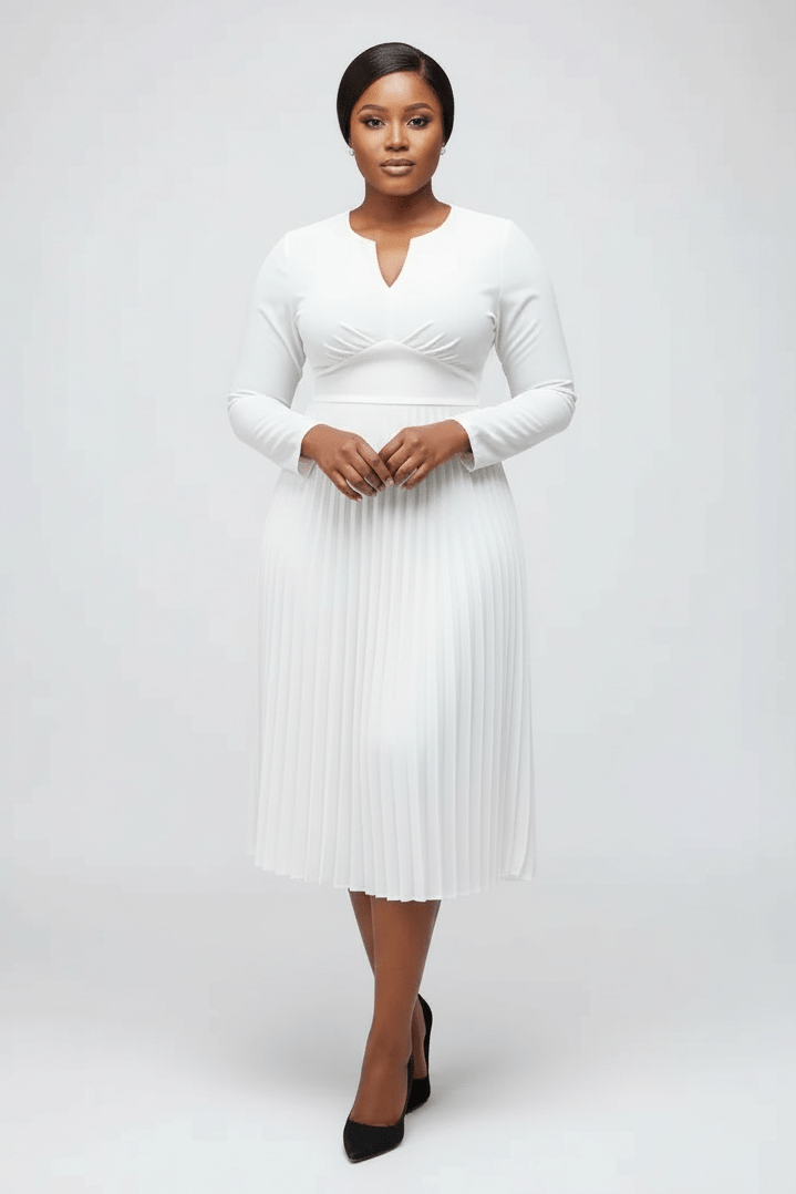 Woman wearing a white dress on a plain background